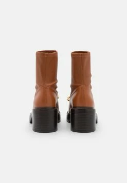 Coach Kenna Bootie - Platform Ankle Boots - Burnished Amber 10 Coach Kenna Bootie - Platform Ankle Boots - Burnished Amber -winter shoes Sales 2023 e42ce0b17fe144bda47989975c9f663e